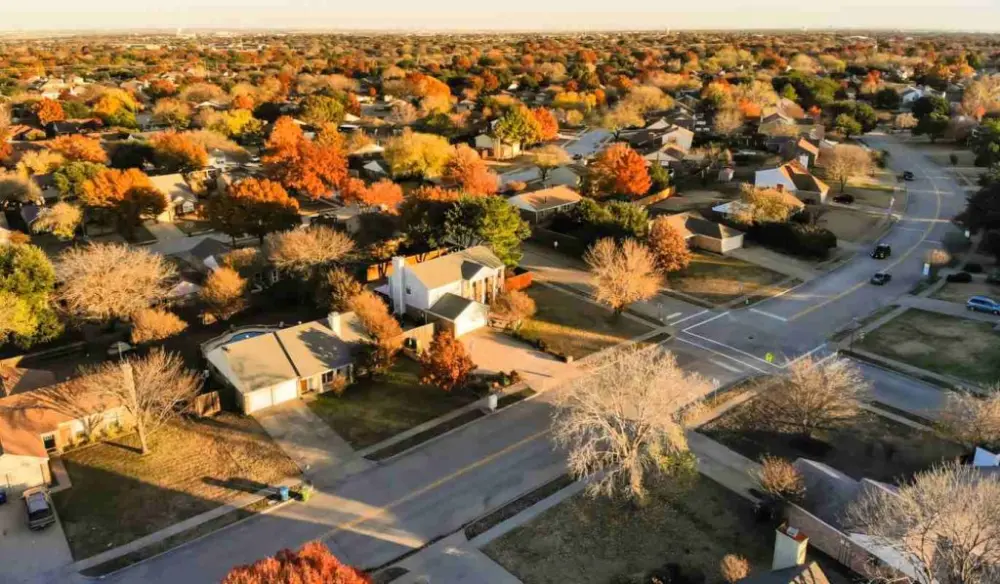 Aerial drone view over residential homes in a large suburb of Dallas