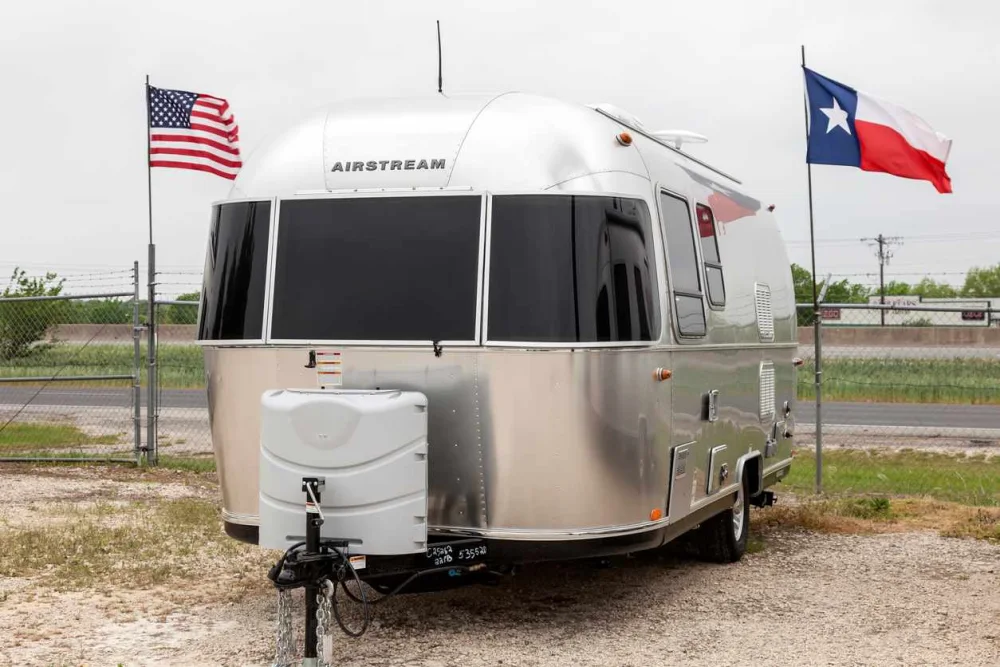 RV with american flag and texas state flag