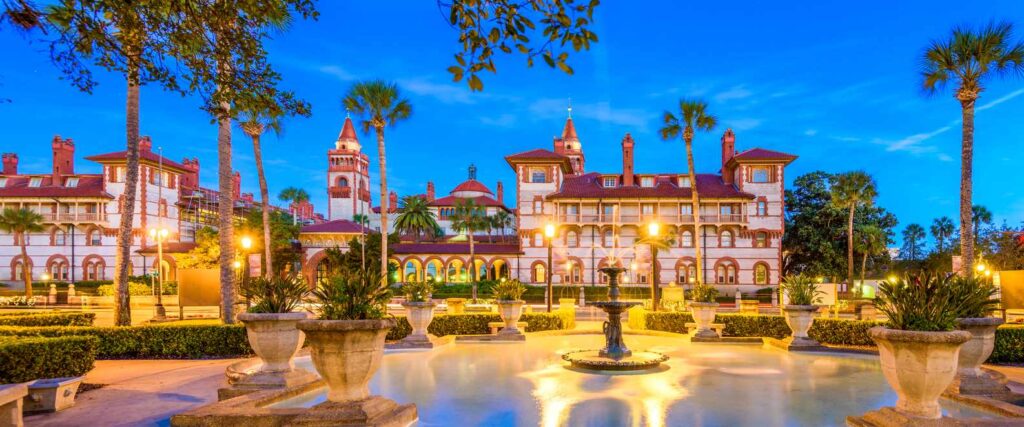 Flagler College lit up with lamps at sunset in Florida.